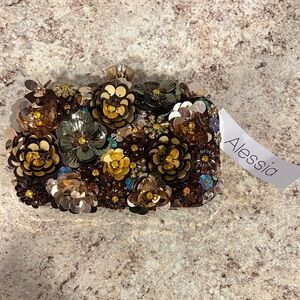 Alessia 
Daisy chain crossbody clutch with brown and gold accents